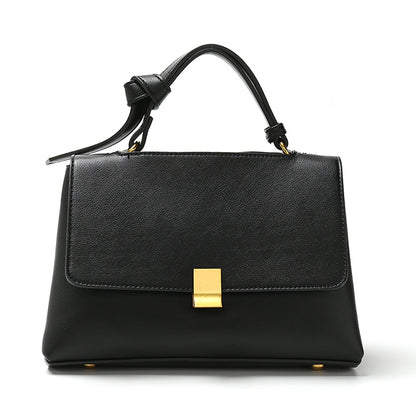 Simple solid color handbag with a slouchy shoulder strap