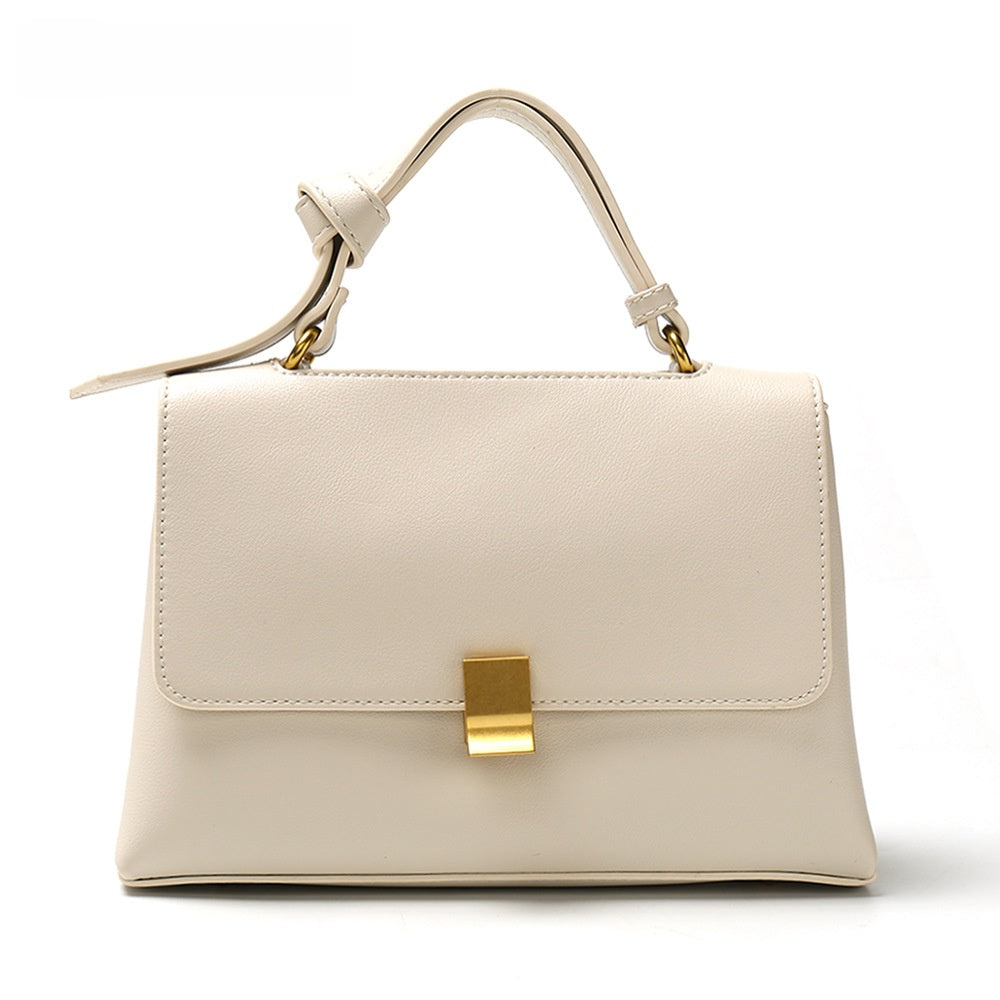 Simple solid color handbag with a slouchy shoulder strap