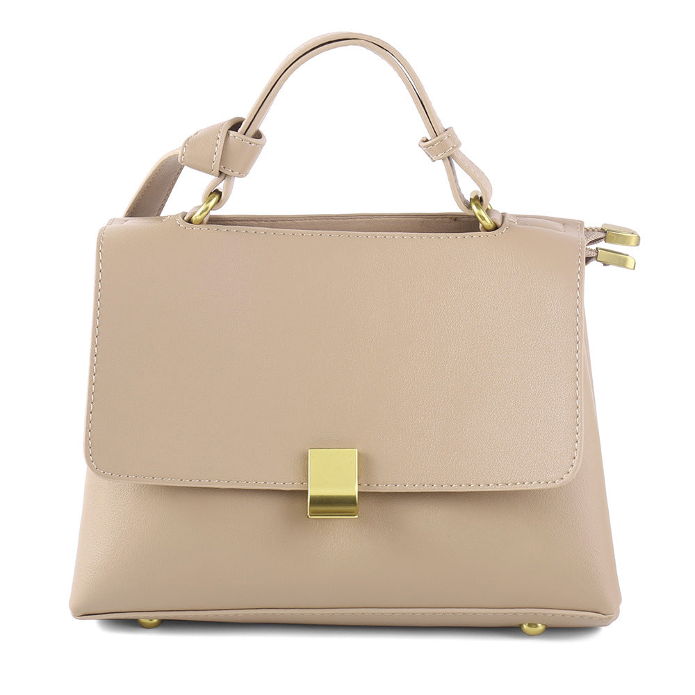 Simple solid color handbag with a slouchy shoulder strap