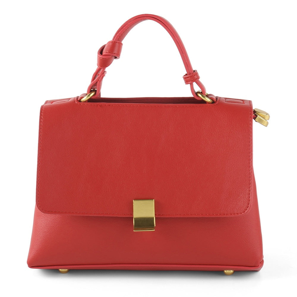 Simple solid color handbag with a slouchy shoulder strap