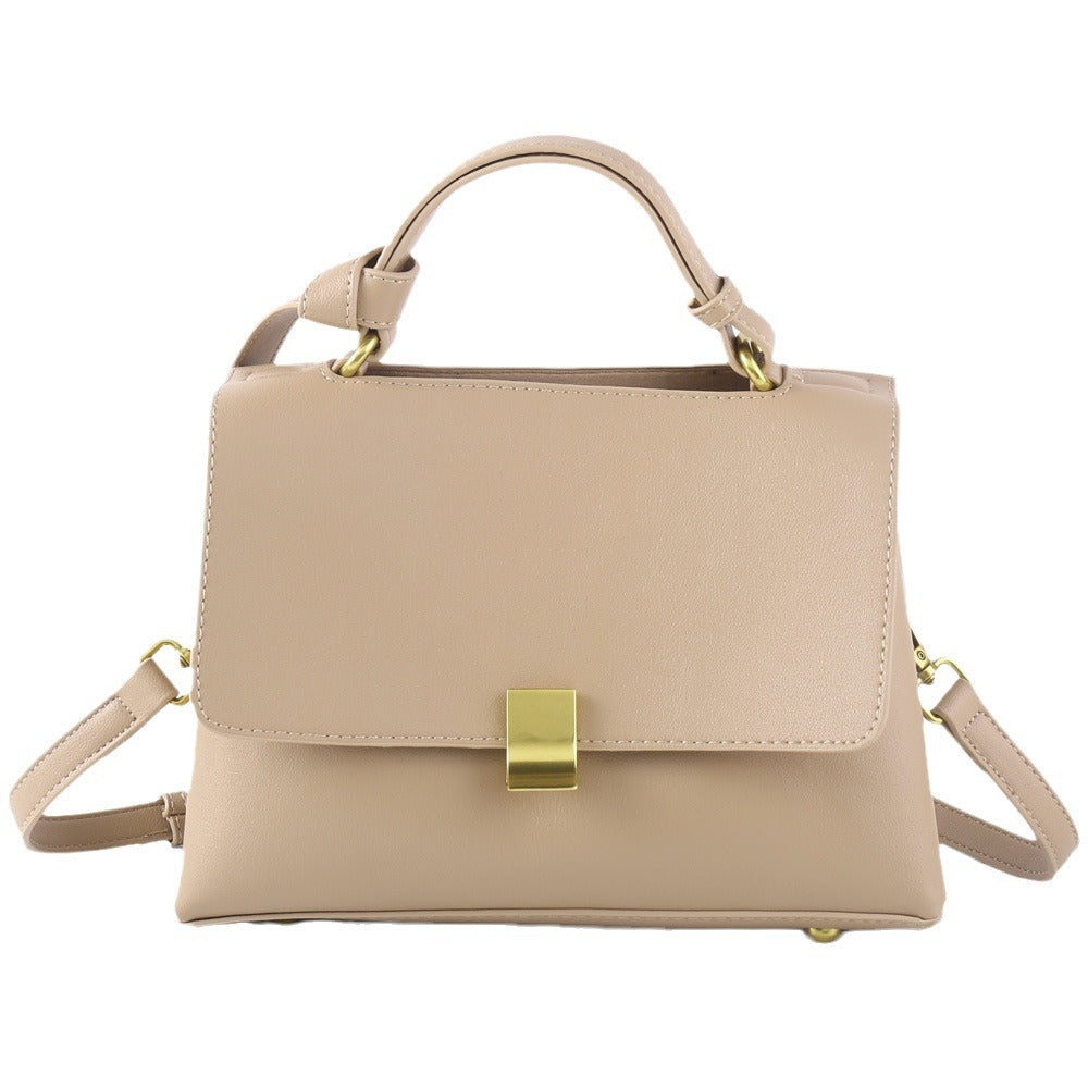 Simple solid color handbag with a slouchy shoulder strap
