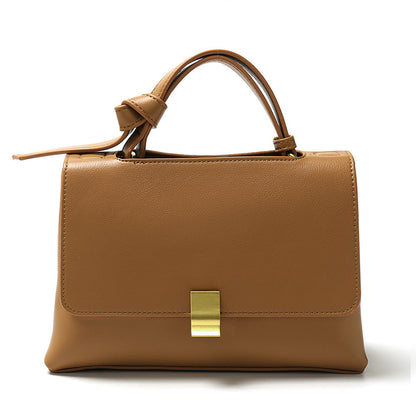 Simple solid color handbag with a slouchy shoulder strap