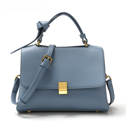 Simple solid color handbag with a slouchy shoulder strap